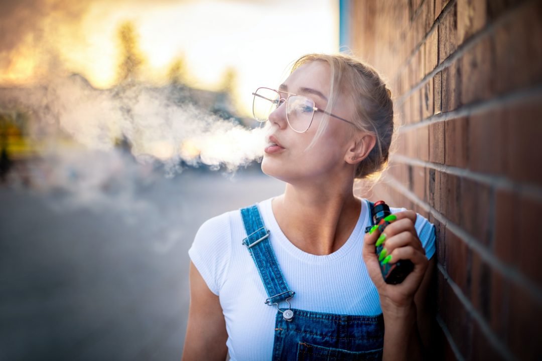 girl vaping outside